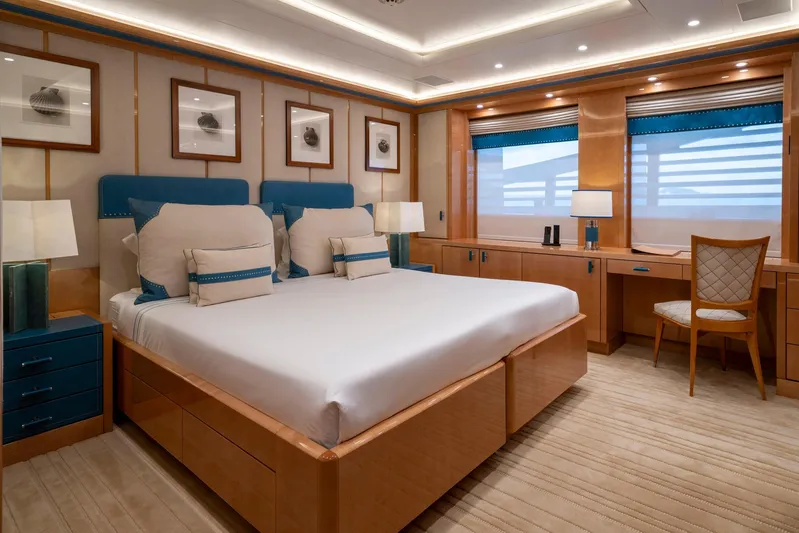 Alfa Nero Yacht Photos Pics Luxurious yacht bedroom with elegant decor, featuring a large bed and stylish furnishings, Oceanco 269', 2007.