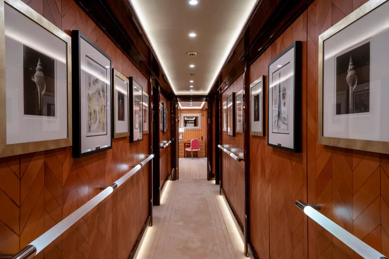 Alfa Nero Yacht Photos Pics Luxurious yacht hallway with framed art, wood paneling, and elegant lighting, Oceanco 269', 2007.
