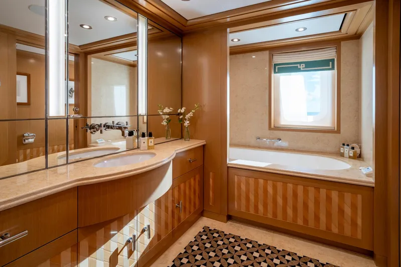 Alfa Nero Yacht Photos Pics Luxurious yacht bathroom with wood accents, large mirror, and elegant bathtub, Oceanco 269', 2007.