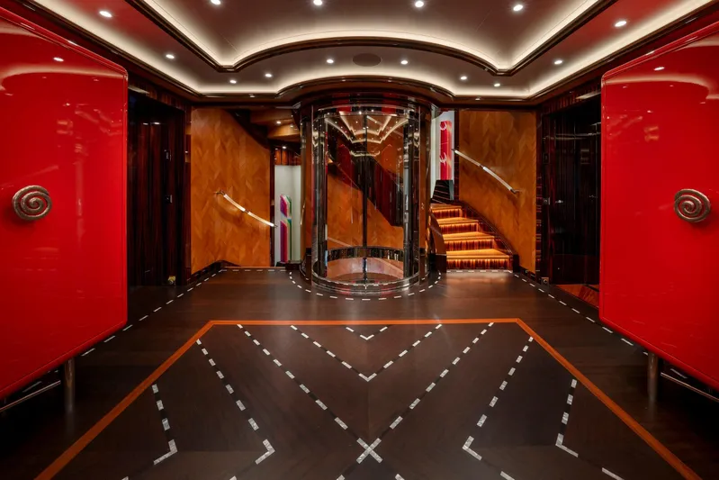 Alfa Nero Yacht Photos Pics Luxurious yacht interior with red accents, elegant staircase, and modern design, Oceanco 269', 2007.