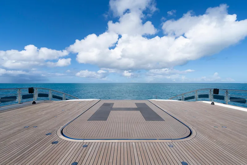 Alfa Nero Yacht Photos Pics Luxurious Oceanco 269' yacht deck with helipad, ocean view, and blue sky, 2007 model.