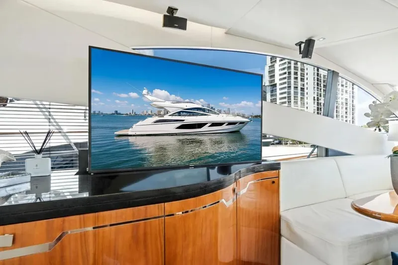  Yacht Photos Pics Luxurious 2017 Sunseeker 68 Sport Yacht interior with modern TV and elegant furnishings.