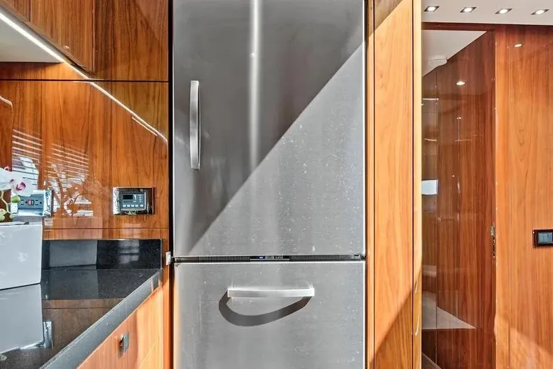  Yacht Photos Pics Modern kitchen interior on 2017 Sunseeker 68 Sport Yacht with stainless steel fridge.