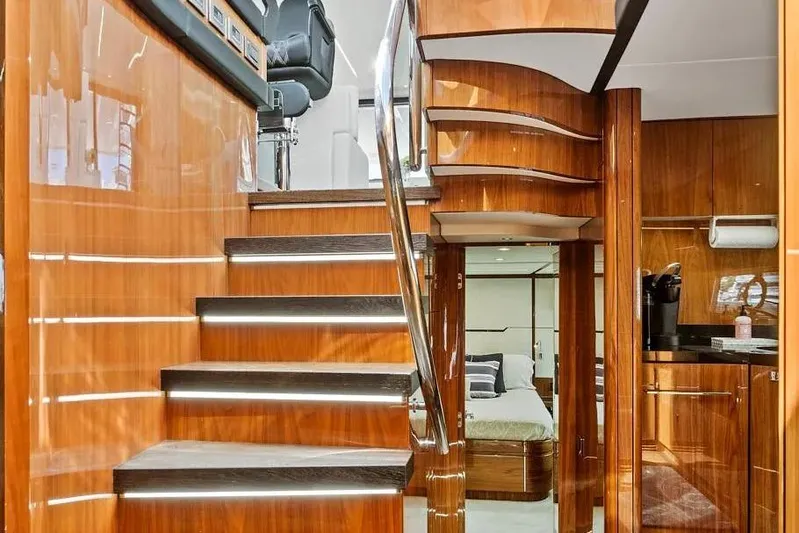  Yacht Photos Pics Luxurious interior of 2017 Sunseeker 68 Sport Yacht with polished wood and modern design.