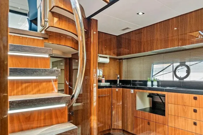  Yacht Photos Pics Luxurious interior of 2017 Sunseeker 68 Sport Yacht with sleek wood finishes.