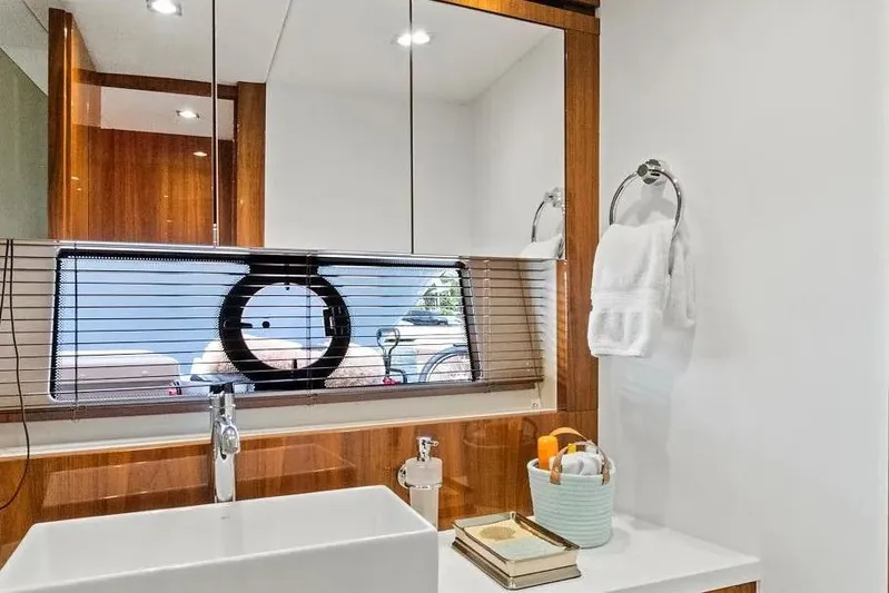  Yacht Photos Pics Luxurious bathroom interior of 2017 Sunseeker 68 Sport Yacht with modern fixtures.