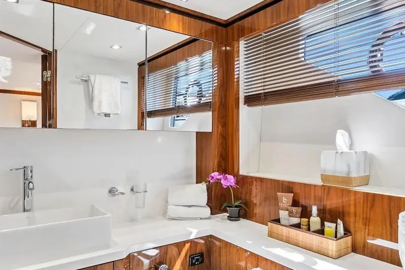  Yacht Photos Pics Luxurious bathroom in 2017 Sunseeker 68 Sport Yacht with elegant wood finishes and modern amenities.