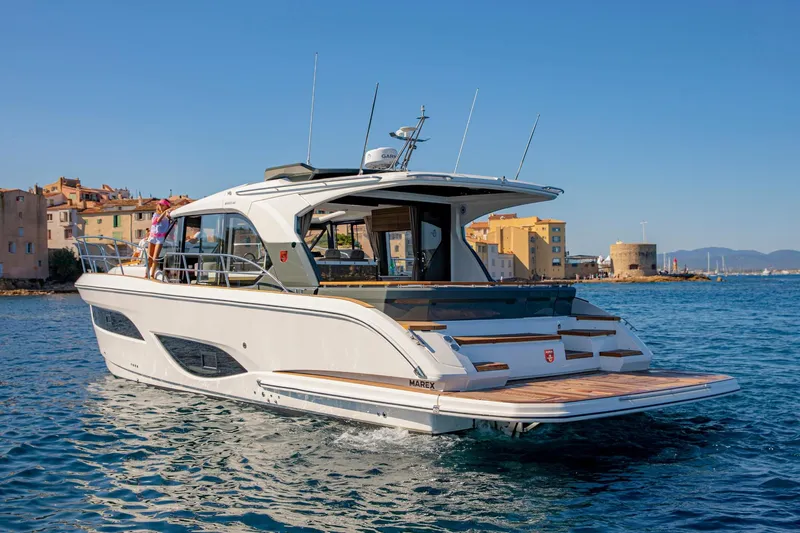  Yacht Photos Pics 2026 Marex 440 Gourmet Cruiser yacht on water near coastal town.