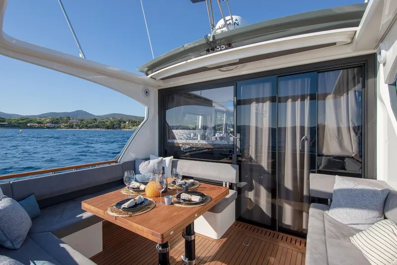  Yacht Photos Pics Luxurious Marex 440 Gourmet Cruiser 2026 yacht with elegant outdoor dining area.