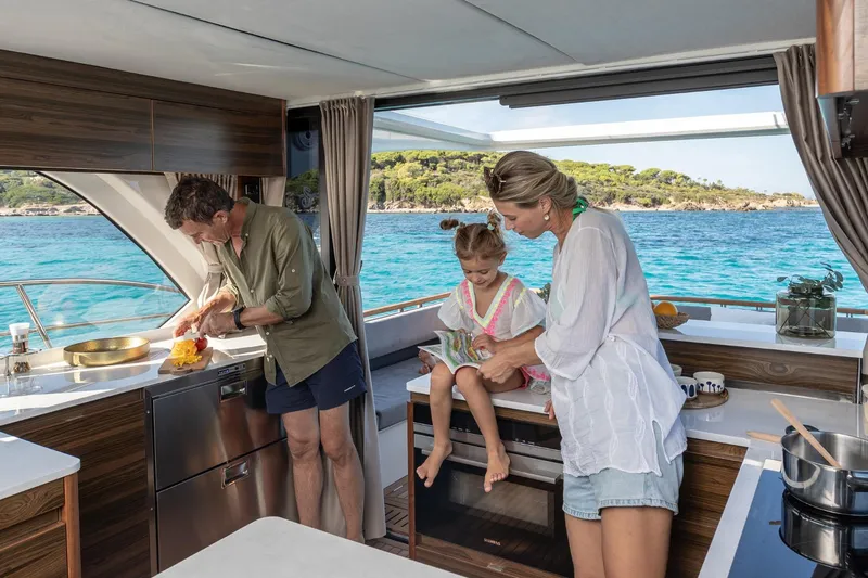  Yacht Photos Pics Family enjoying time on a 2026 Marex 440 Gourmet Cruiser yacht kitchen.