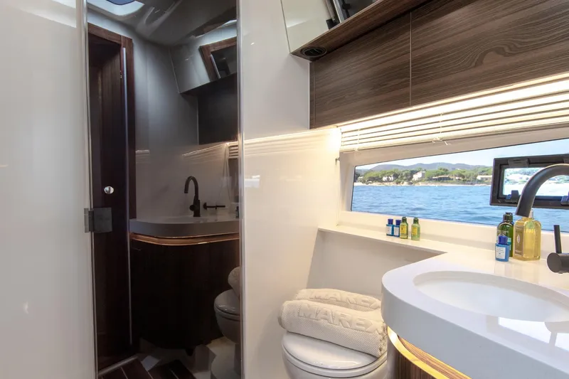  Yacht Photos Pics Luxurious bathroom interior of 2026 Marex 440 Gourmet Cruiser with scenic ocean view.
