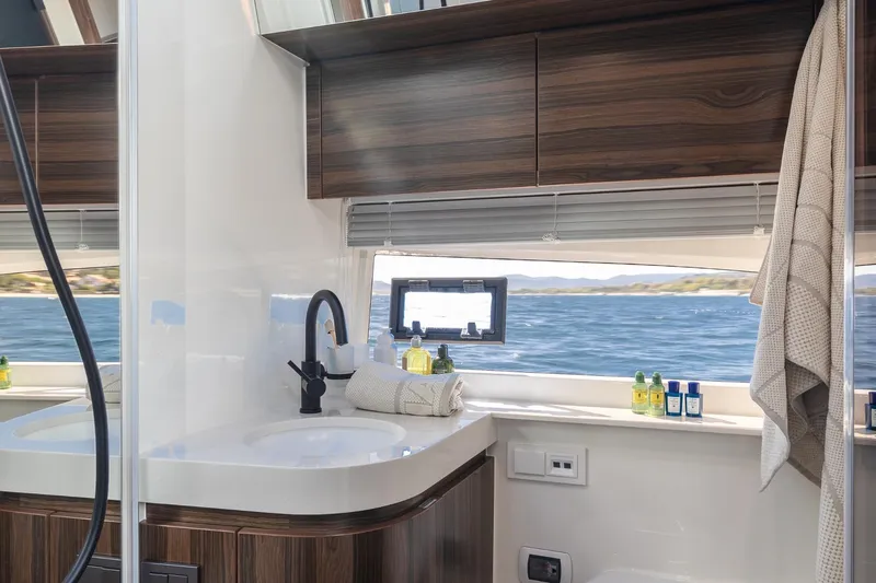  Yacht Photos Pics Luxurious bathroom interior of 2026 Marex 440 Gourmet Cruiser with ocean view.
