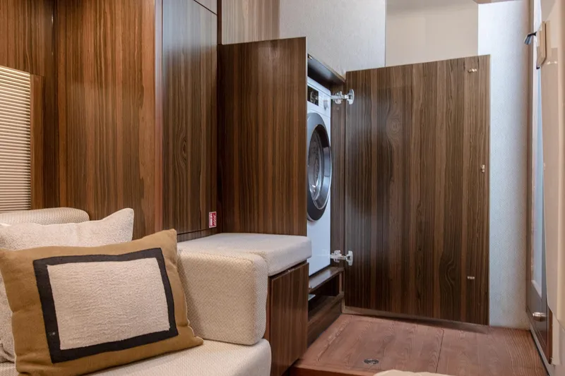  Yacht Photos Pics Interior of 2026 Marex 440 Gourmet Cruiser with wood paneling and built-in washer.