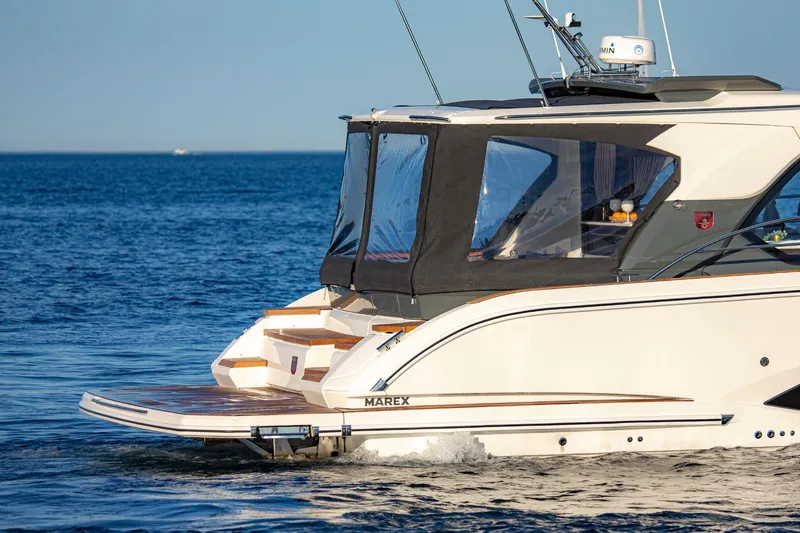  Yacht Photos Pics 2026 Marex 440 Gourmet Cruiser yacht on open water, rear view.