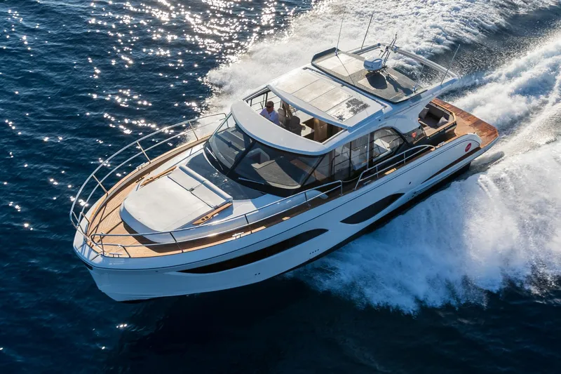  Yacht Photos Pics 2026 Marex 440 Gourmet Cruiser yacht navigating through blue ocean waters.