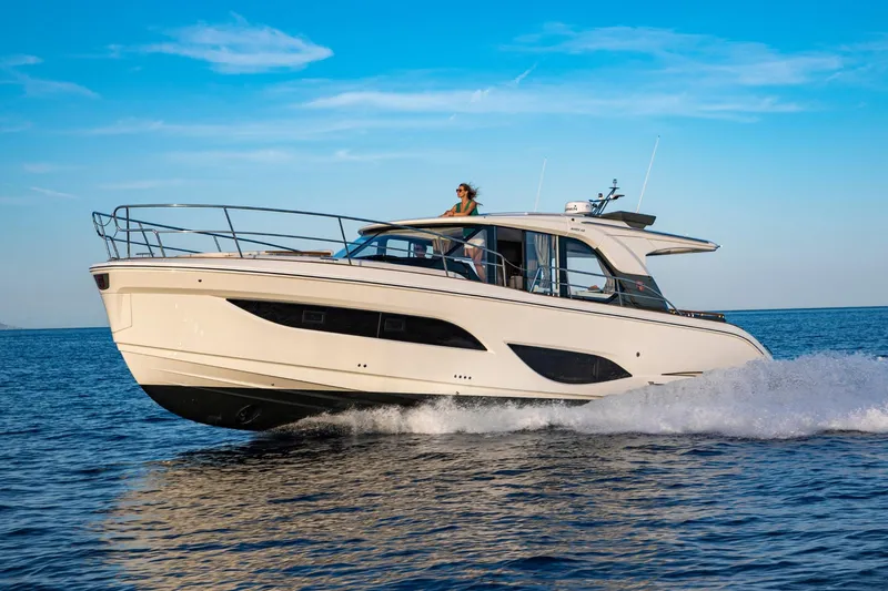  Yacht Photos Pics 2026 Marex 440 Gourmet Cruiser yacht cruising on open water under clear blue sky.