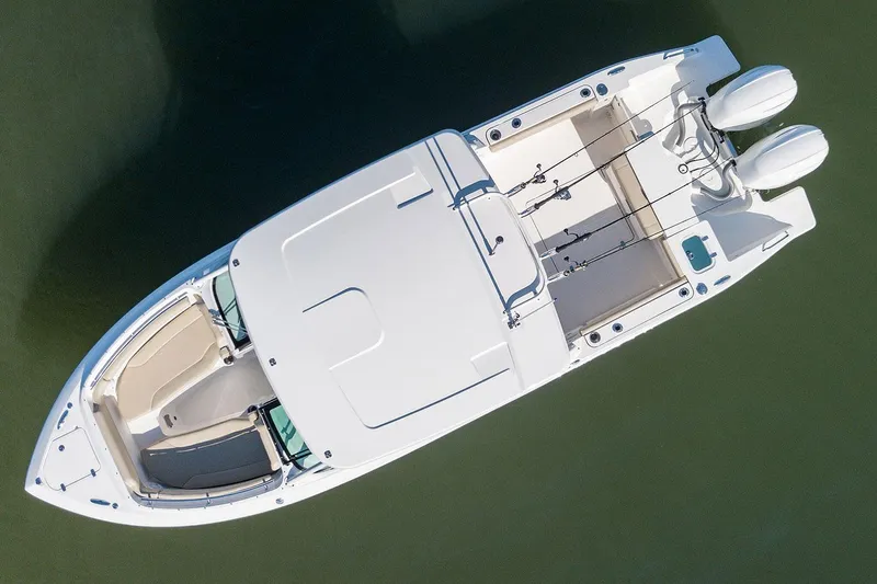 T/t Lucky Seven Yacht Photos Pics Manufacturer Provided Image: 2022 Pursuit DC 266 Dual Console boat, aerial view, white hull, twin engines.