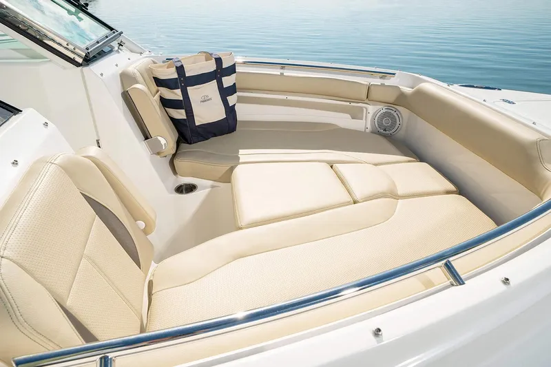T/t Lucky Seven Yacht Photos Pics Manufacturer Provided Image: 2022 Pursuit DC 266 Dual Console boat interior with beige seating and a tote bag.