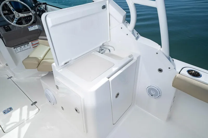 T/t Lucky Seven Yacht Photos Pics Manufacturer Provided Image: 2022 Pursuit DC 266 Dual Console boat interior with open storage compartment.