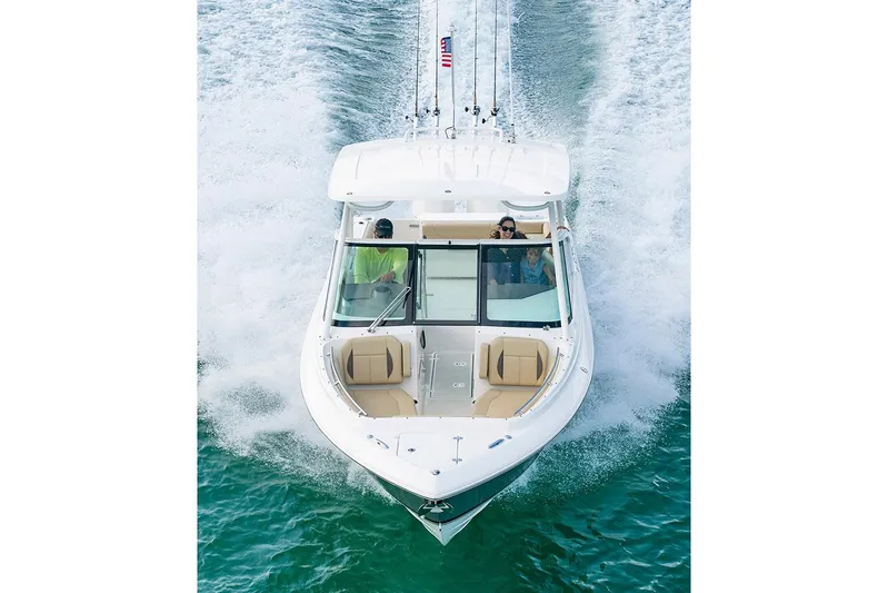T/t Lucky Seven Yacht Photos Pics Manufacturer Provided Image: 2022 Pursuit DC 266 Dual Console boat cruising on water.