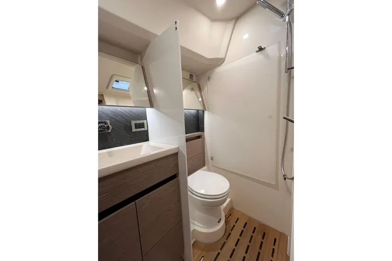 Eto Mio Yacht Photos Pics Modern bathroom in 2021 Hanse 508 yacht with sleek fixtures and wooden flooring.