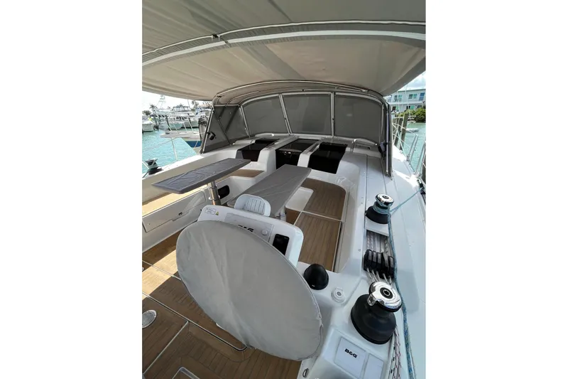 Eto Mio Yacht Photos Pics 2021 Hanse 508 yacht deck with seating and covered helm, docked at marina.