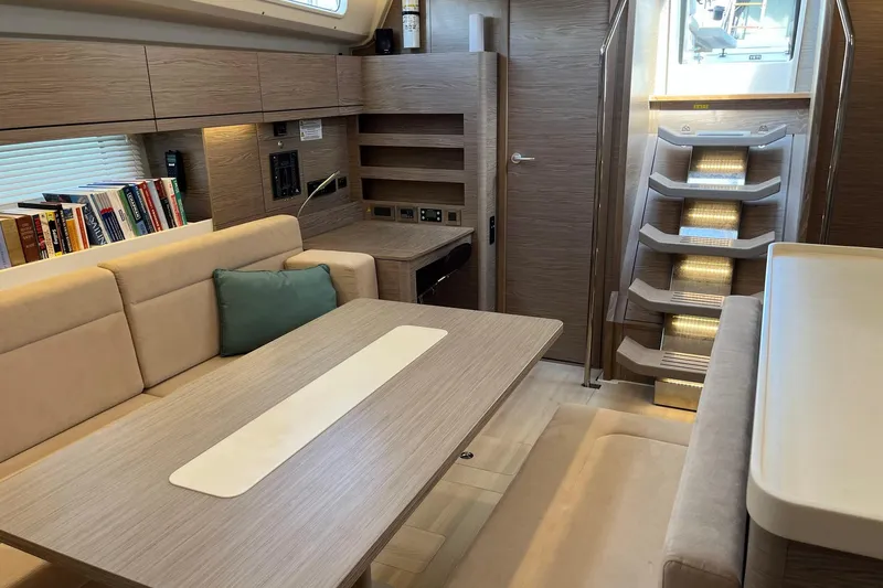 Eto Mio Yacht Photos Pics Luxurious interior of 2021 Hanse 508 yacht with modern seating and elegant wooden finishes.