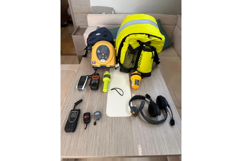Eto Mio Yacht Photos Pics Safety equipment on a Hanse 508 yacht, including life jackets, radios, and a defibrillator.