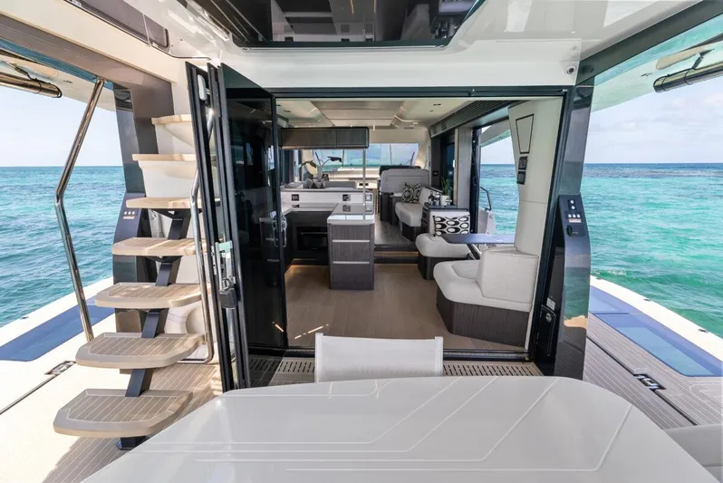 Dad Bod Yacht Photos Pics Luxurious interior of 2024 Galeon 560 Fly yacht with ocean view.