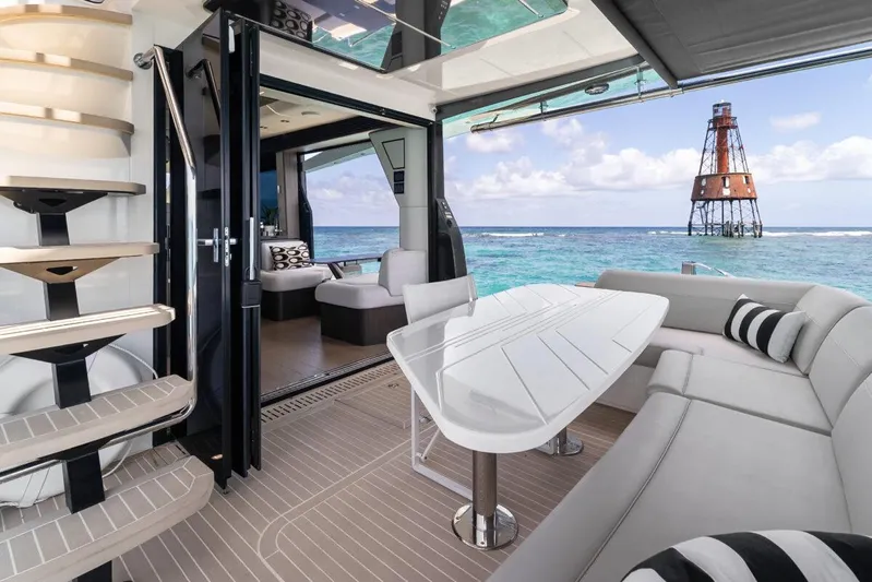 Dad Bod Yacht Photos Pics Luxurious interior of 2024 Galeon 560 Fly yacht with ocean view and modern seating.