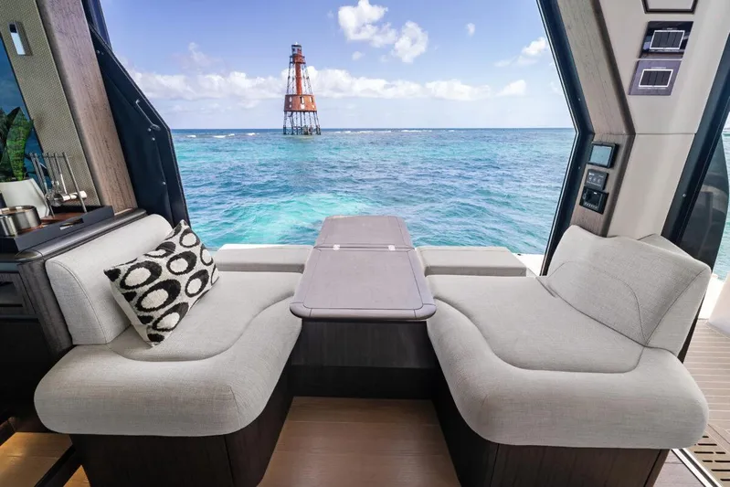 Dad Bod Yacht Photos Pics Luxurious interior of 2024 Galeon 560 Fly yacht with ocean view and modern seating.