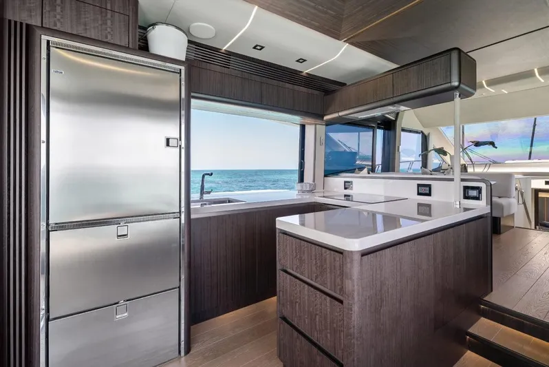 Dad Bod Yacht Photos Pics Luxurious kitchen interior of 2024 Galeon 560 Fly yacht with ocean view.