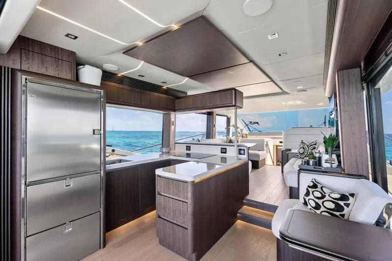 Dad Bod Yacht Photos Pics Luxurious interior of 2024 Galeon 560 Fly yacht with modern kitchen and ocean view.