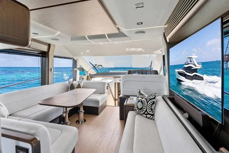 Dad Bod Yacht Photos Pics Luxurious interior of 2024 Galeon 560 Fly yacht with ocean view.