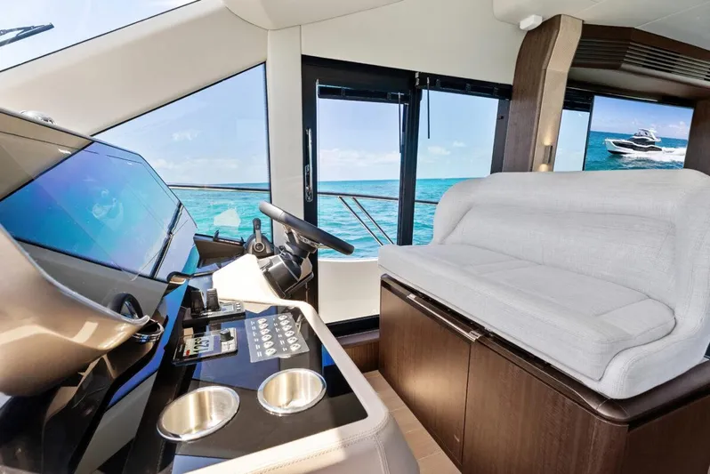 Dad Bod Yacht Photos Pics Interior of 2024 Galeon 560 Fly yacht with modern helm and ocean view.