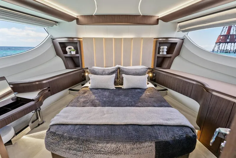 Dad Bod Yacht Photos Pics Luxurious 2024 Galeon 560 Fly yacht bedroom with modern design and ocean view.