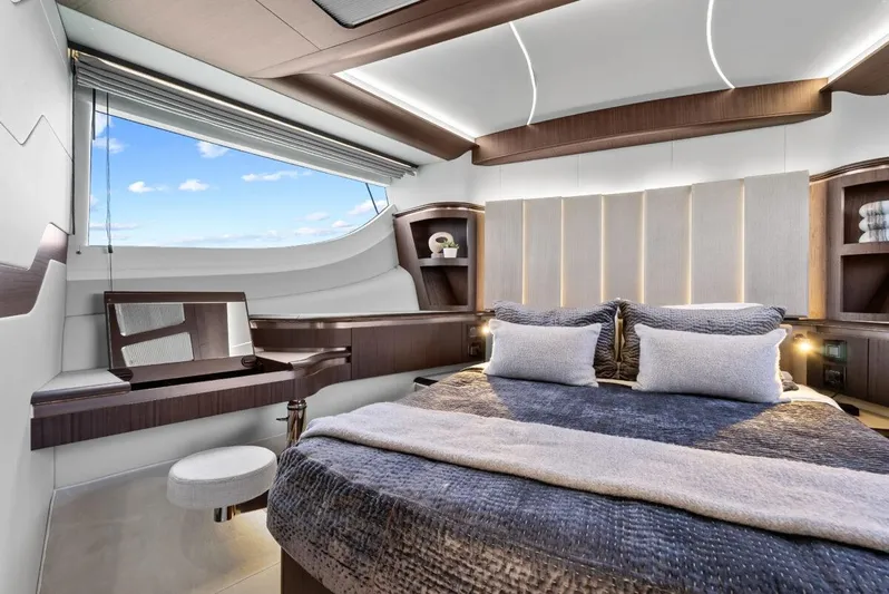 Dad Bod Yacht Photos Pics Luxurious bedroom interior of 2024 Galeon 560 Fly yacht with modern design and ocean view.