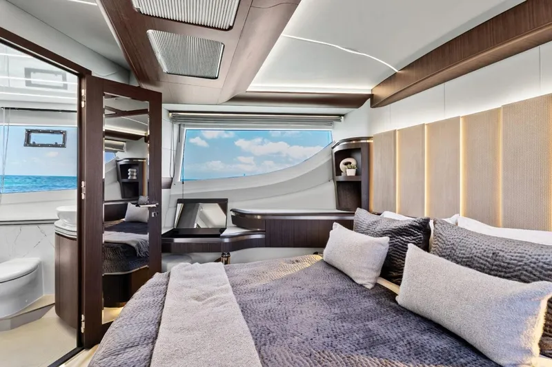 Dad Bod Yacht Photos Pics Luxurious interior of 2024 Galeon 560 Fly yacht with modern bedroom and ocean view.