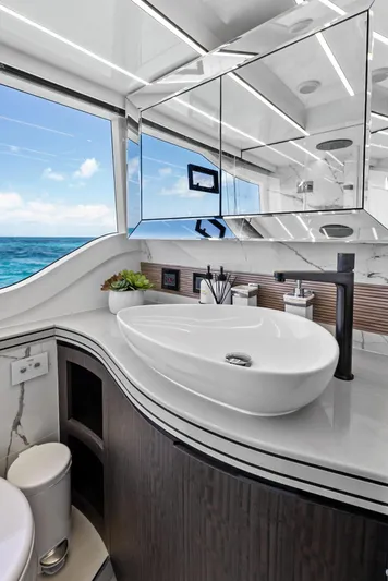 Dad Bod Yacht Photos Pics Luxurious bathroom on 2024 Galeon 560 Fly yacht with ocean view and modern fixtures.