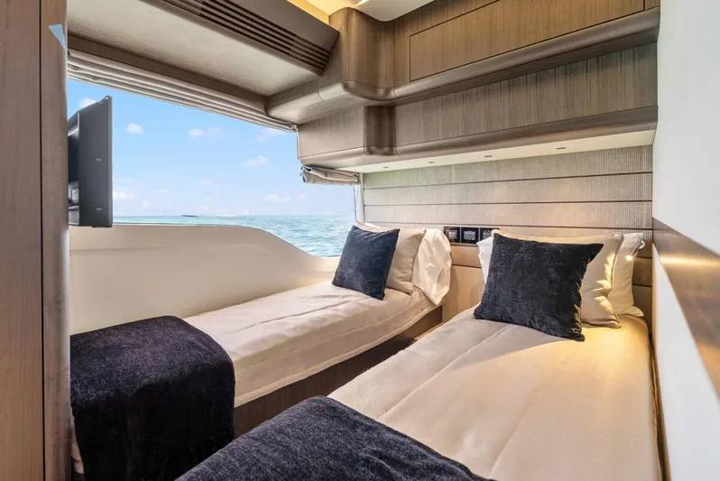 Dad Bod Yacht Photos Pics Luxurious twin cabin interior of 2024 Galeon 560 Fly yacht with ocean view.