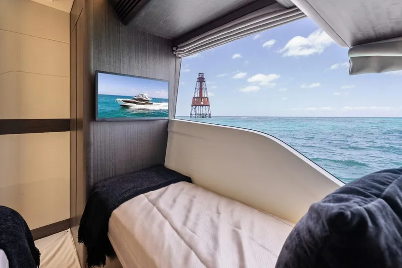 Dad Bod Yacht Photos Pics Luxurious cabin view inside 2024 Galeon 560 Fly yacht, featuring ocean scenery and modern interior.