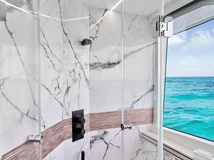 Dad Bod Yacht Photos Pics Luxurious marble bathroom with ocean view on 2024 Galeon 560 Fly yacht.