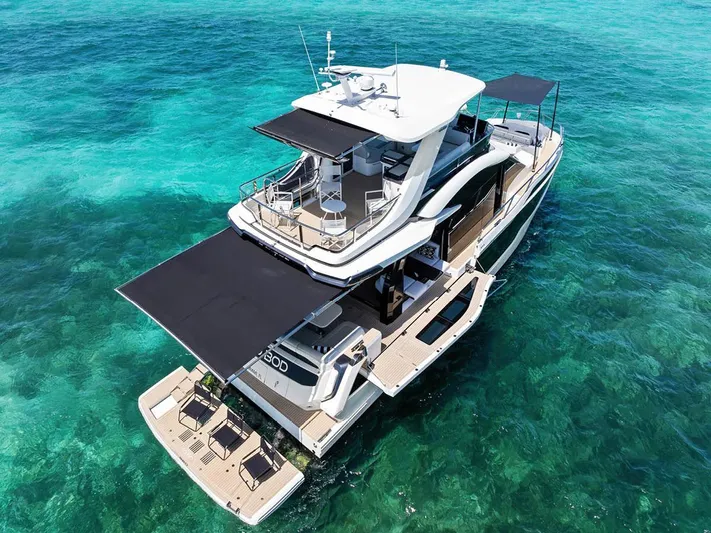 Dad Bod Yacht Photos Pics Luxury 2024 Galeon 560 Fly yacht on clear turquoise water, aerial view.