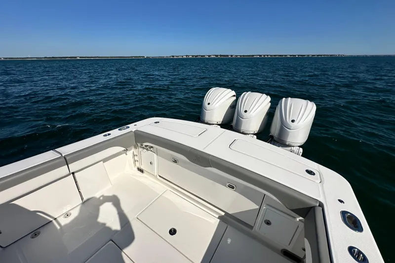 Shark Gray Yacht Photos Pics 2024 Regulator 34 boat with triple engines on open water.