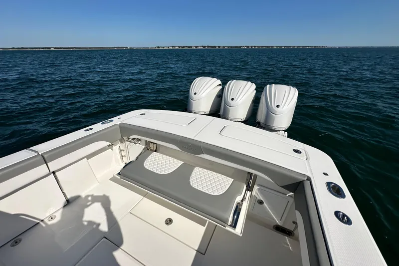 Shark Gray Yacht Photos Pics 2024 Regulator 34 boat with triple engines on open water.