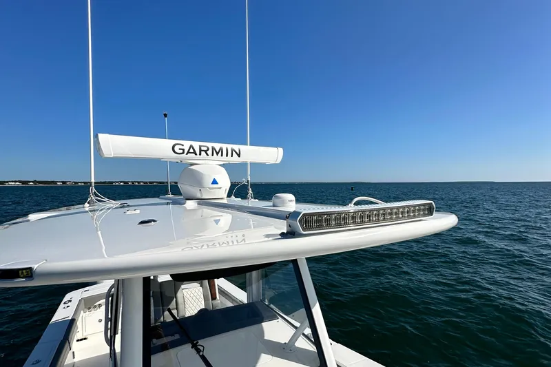 Shark Gray Yacht Photos Pics 2024 Regulator 34 boat with Garmin radar on open water.