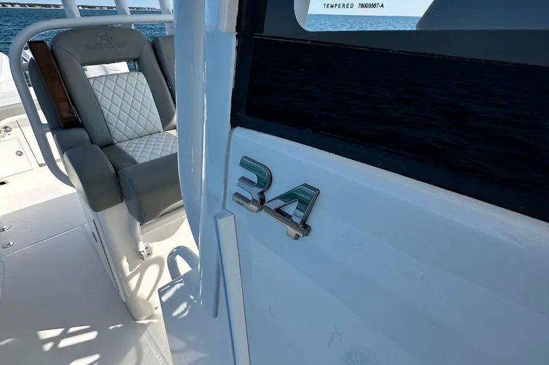 Shark Gray Yacht Photos Pics 2024 Regulator 34 boat interior with luxury seating and model emblem.