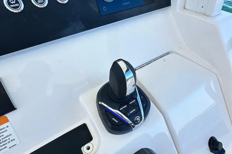 Shark Gray Yacht Photos Pics 2024 Regulator 34 boat control panel with joystick and buttons.
