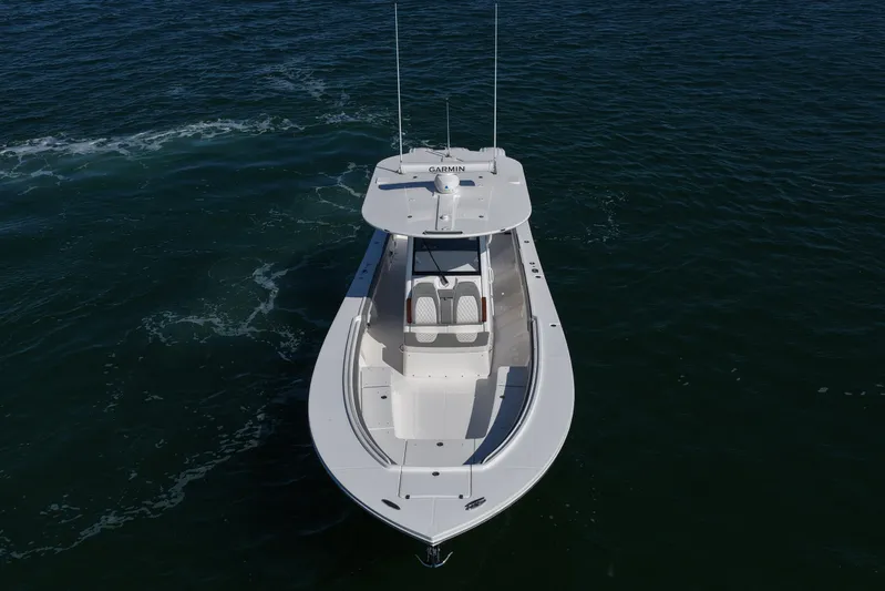 Shark Gray Yacht Photos Pics 2024 Regulator 34 boat on open water, aerial view showcasing sleek design.