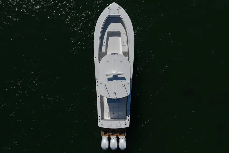 Shark Gray Yacht Photos Pics Aerial view of 2024 Regulator 34 boat on dark water.